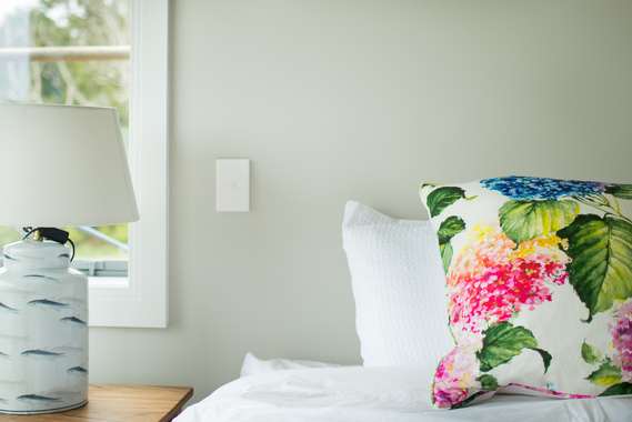 Photo of bedroom details in front of a light gray wall