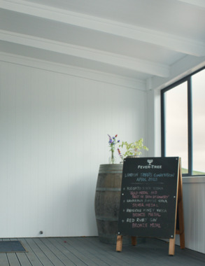 Photo of the entrance of a bar with a sign